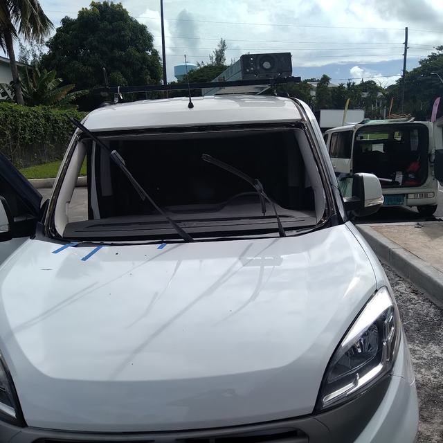 Windshield installed on a white Kia